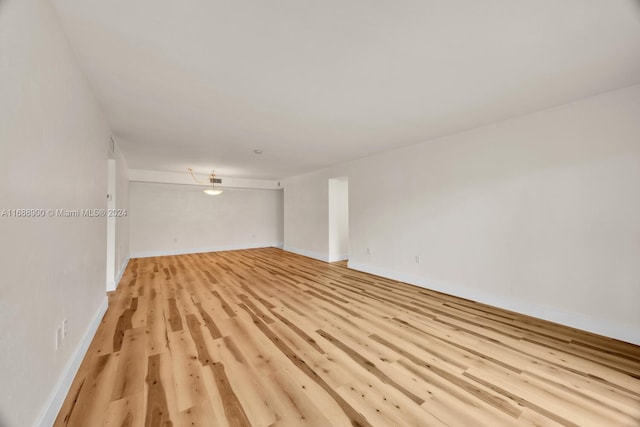 spare room with light wood-type flooring