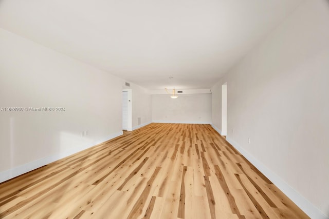 spare room featuring light wood-type flooring