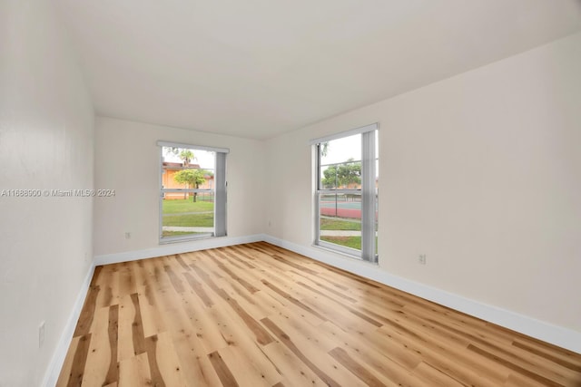 spare room featuring light wood-type flooring