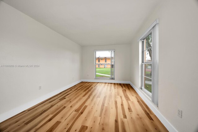 unfurnished room with light hardwood / wood-style flooring