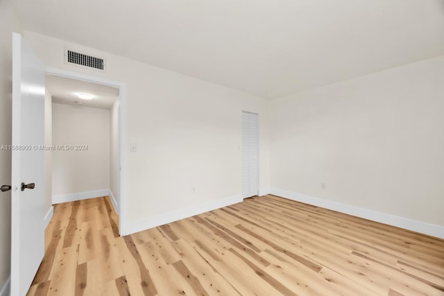 empty room with light wood-type flooring