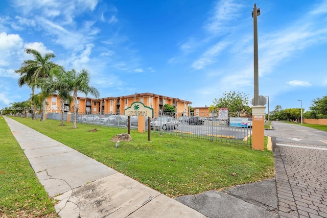 view of community featuring a yard