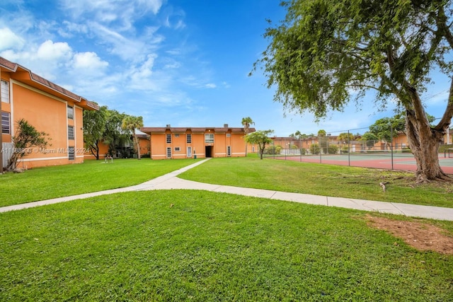 view of property's community featuring a yard