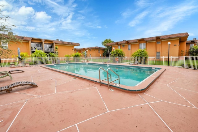 view of pool featuring a patio