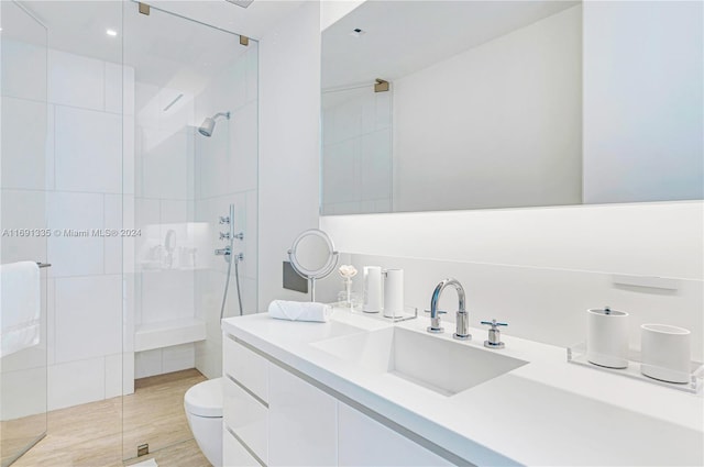 9111 Collins Ave Unit N-Ph6, Surfside, FL 33154 - bathroom with a tile shower, toilet, and vanity