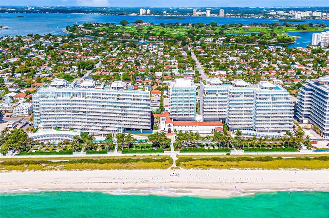 birds eye view of property featuring a view of the beach and a water view