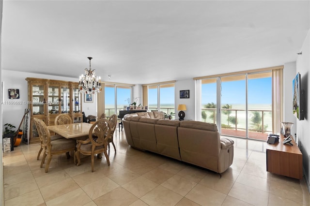 8855 Collins Ave Unit 5A, Surfside, FL 33154 - dining area with a chandelier, floor to ceiling windows, and light tile patterned floors