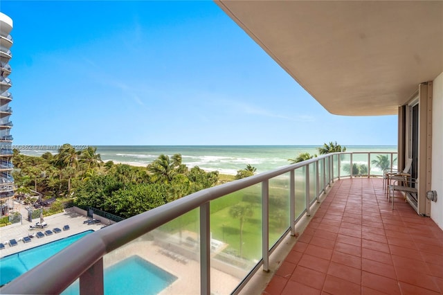 8855 Collins Ave Unit 5A, Surfside, FL 33154 - balcony featuring view of pool and a water view