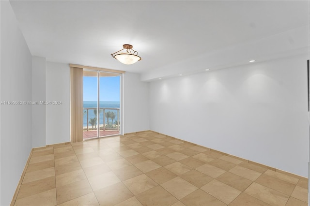8855 Collins Ave Unit 5A, Surfside, FL 33154 - unfurnished room with floor to ceiling windows