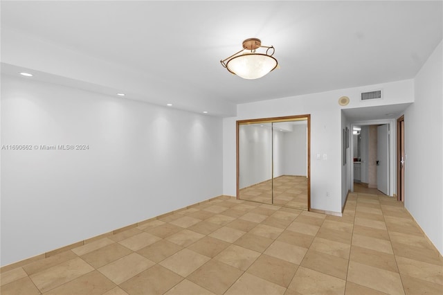 8855 Collins Ave Unit 5A, Surfside, FL 33154 - unfurnished bedroom featuring a closet and recessed lighting
