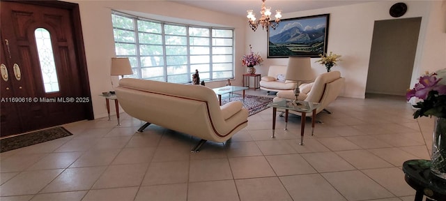 tiled living room featuring a notable chandelier