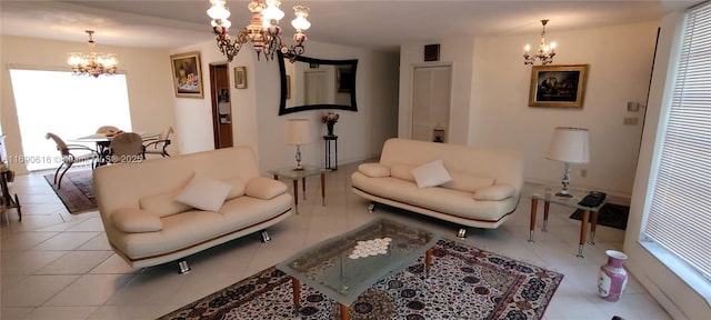 living room with light tile patterned flooring and an inviting chandelier