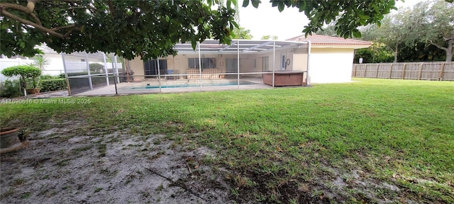 view of yard featuring a pool with hot tub, a patio area, and glass enclosure