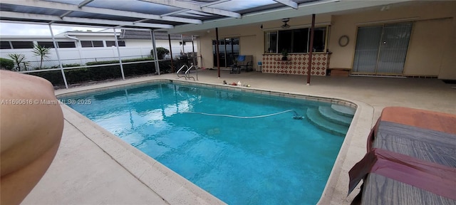 view of pool with a lanai and a patio area