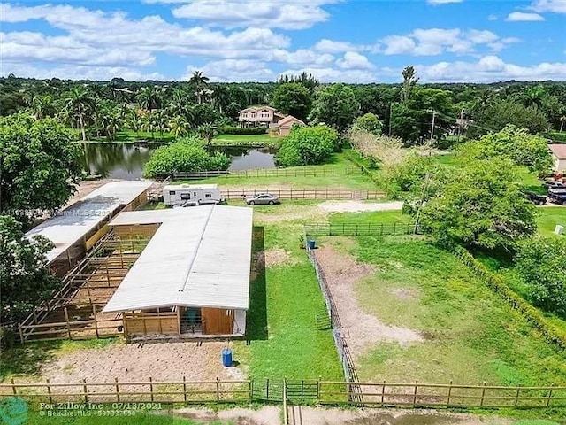 birds eye view of property featuring a rural view and a water view