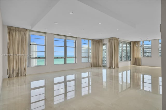 unfurnished living room featuring a wealth of natural light