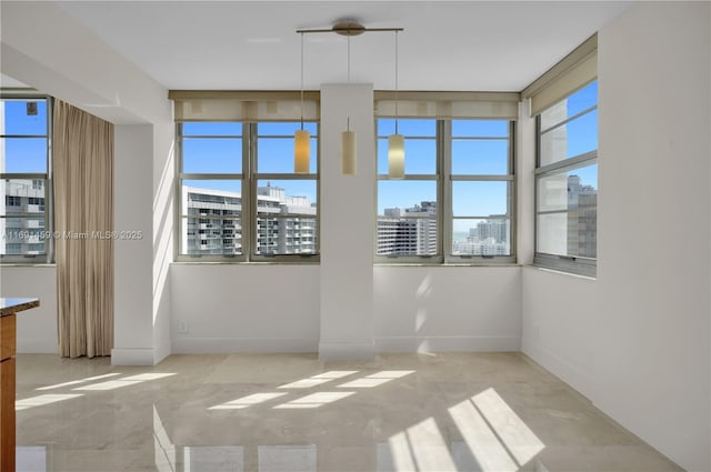 empty room featuring plenty of natural light