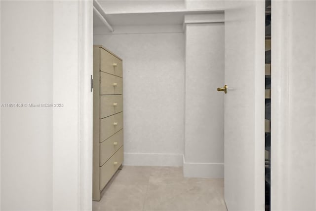 walk in closet featuring light tile patterned floors