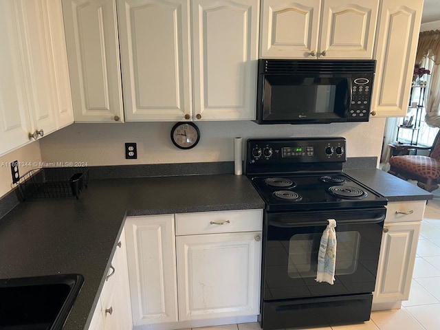 kitchen featuring white cabinets, black appliances, and light tile patterned floors