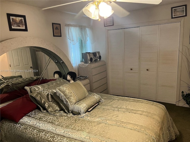 bedroom with ceiling fan and a closet