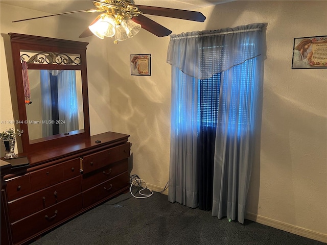 carpeted bedroom featuring ceiling fan