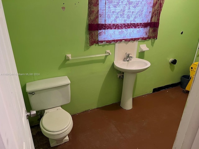 bathroom with toilet and sink