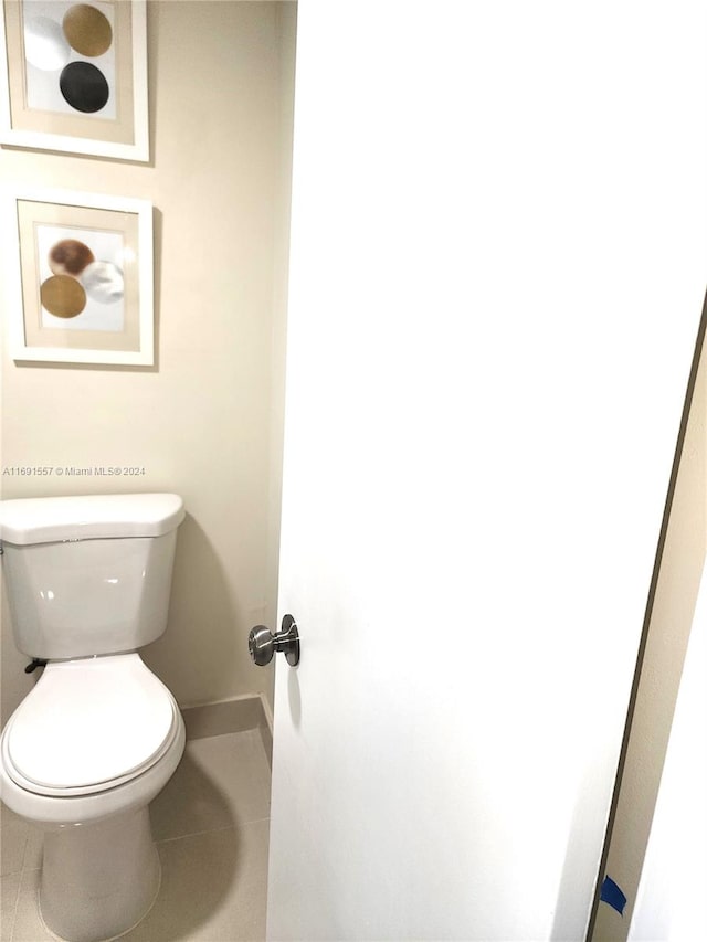 bathroom featuring tile patterned flooring and toilet