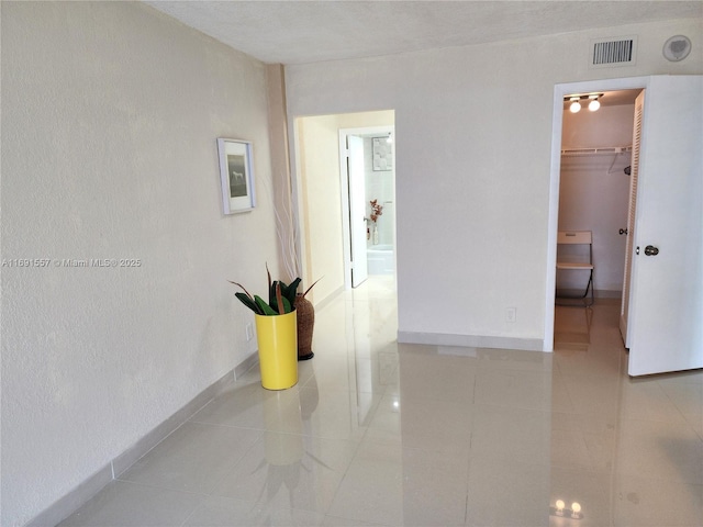 800 SE 20th Ave Unit 1109, Deerfield Beach, FL 33441 - hall with baseboards, visible vents, and tile patterned flooring