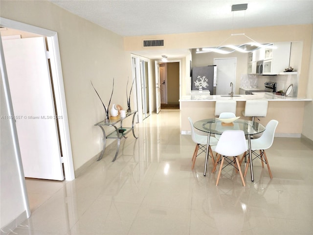 800 SE 20th Ave Unit 1109, Deerfield Beach, FL 33441 - dining space with baseboards and visible vents