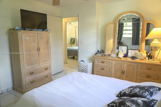 tiled bedroom featuring connected bathroom