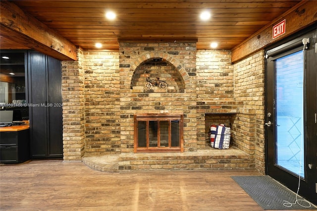 unfurnished living room featuring wood-type flooring and wood ceiling