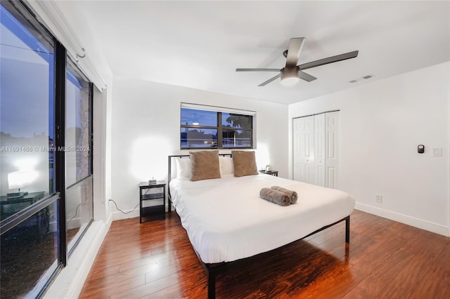 bedroom featuring hardwood / wood-style floors, a closet, and ceiling fan