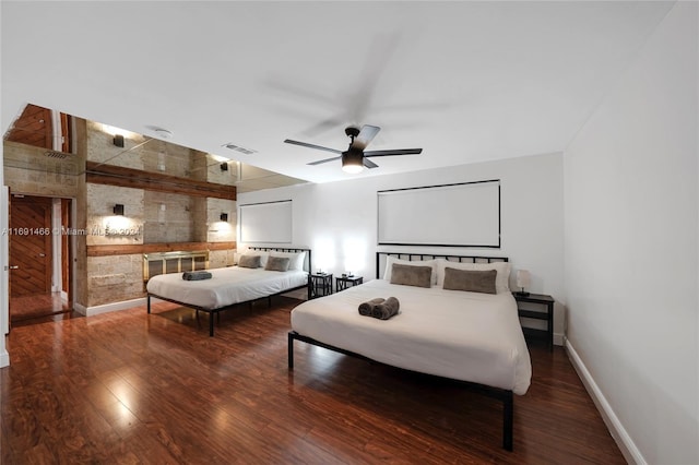 bedroom featuring hardwood / wood-style floors and ceiling fan