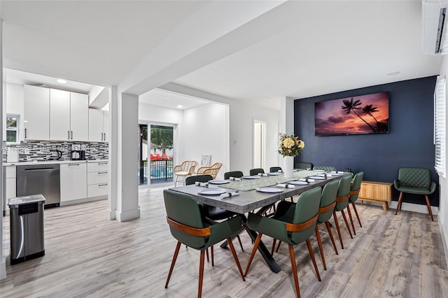 dining space featuring light wood-type flooring