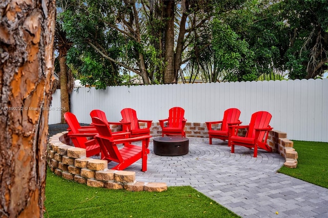 view of patio with a fire pit