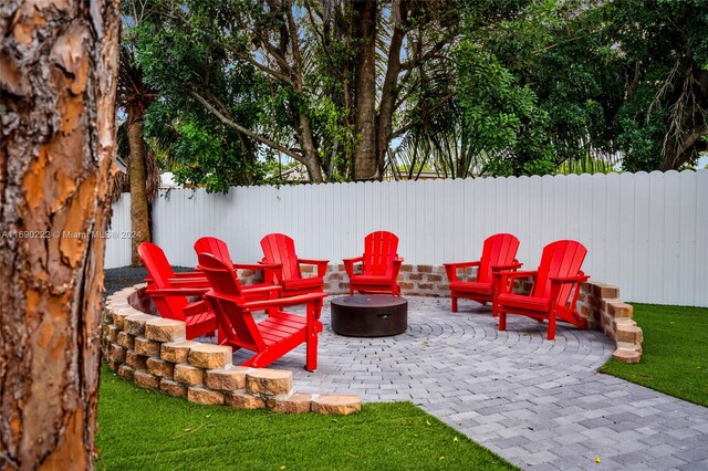 1899 NE 49th Ct, Pompano Beach, FL 33064 - view of patio with a fire pit