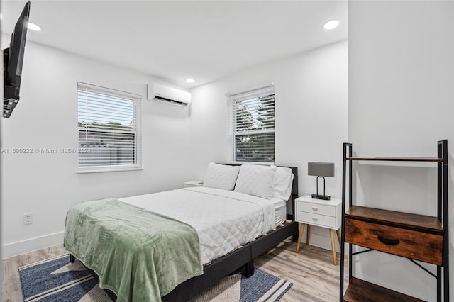 1899 NE 49th Ct, Pompano Beach, FL 33064 - bedroom with multiple windows, wood-type flooring, and a wall mounted air conditioner