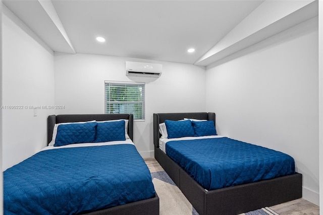 1899 NE 49th Ct, Pompano Beach, FL 33064 - bedroom featuring hardwood / wood-style floors, a wall unit AC, and lofted ceiling