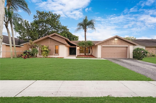 ranch-style home with a garage and a front yard