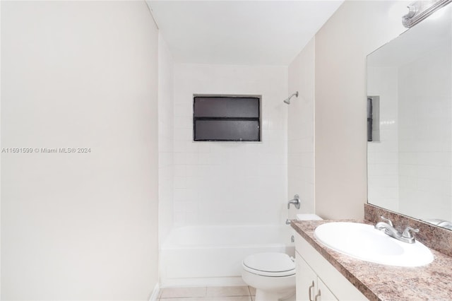 full bathroom with tile patterned flooring, vanity, toilet, and tiled shower / bath