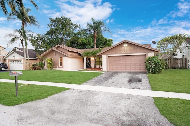 ranch-style home with a front yard and a garage