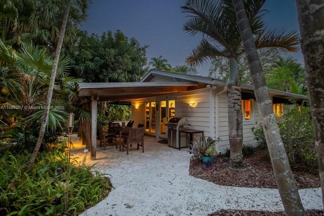 13470 SW 67th Ave, Pinecrest, FL 33156 - view of patio / terrace with a grill and outdoor dining space