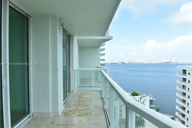 balcony featuring a water view