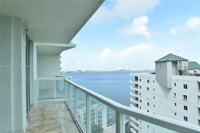 balcony featuring a water view