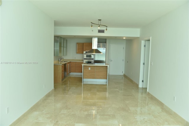 kitchen with range hood, appliances with stainless steel finishes, and sink