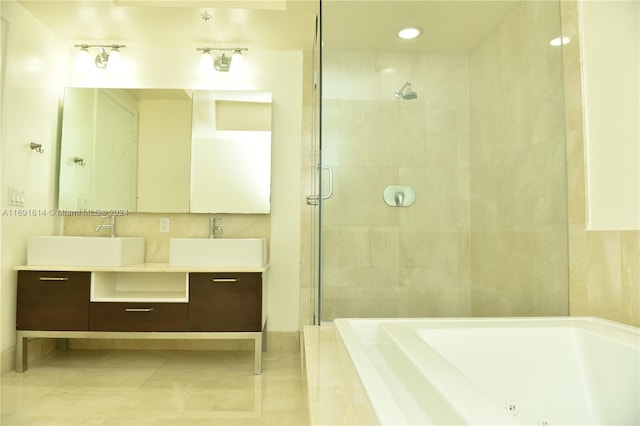 bathroom with vanity, shower with separate bathtub, and tile patterned floors