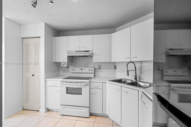 kitchen with sink, light tile patterned floors, extractor fan, white appliances, and white cabinets