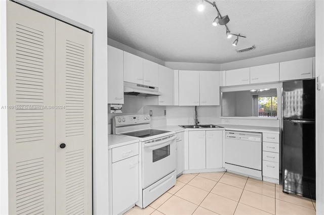 kitchen featuring white cabinets, a textured ceiling, white appliances, and sink