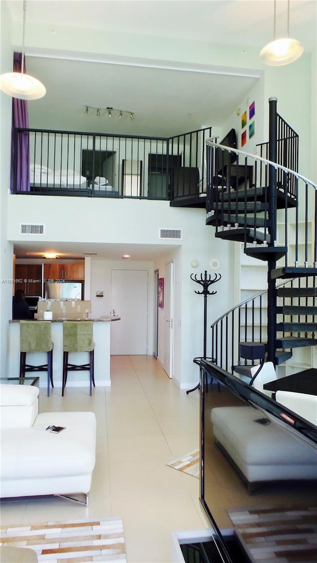 living room featuring a high ceiling