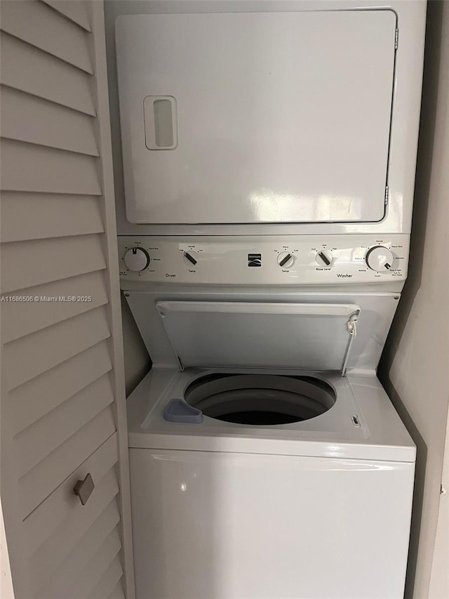 laundry room featuring stacked washing maching and dryer